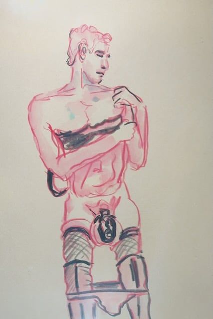 Noah removes a bralet while wearing a cage and hose